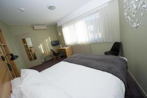 Postel nebo postele na pokoji v ubytování Mon Hotel à Gap