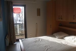 Een bed of bedden in een kamer bij Residentie Koksijde promenade