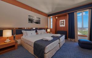 Cama ou camas em um quarto em Algarve Casino Hotel