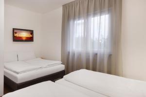 Postel nebo postele na pokoji v ubytování Hotel Asterix