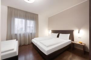Postel nebo postele na pokoji v ubytování Hotel Asterix