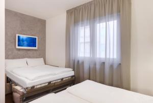 Postel nebo postele na pokoji v ubytování Hotel Asterix