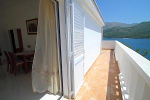 an open balcony with a view of the water at Villa on the Sea Rock in Slano