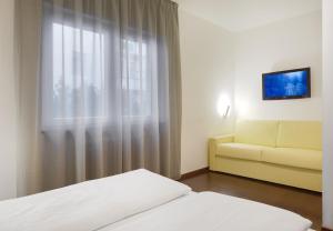 Postel nebo postele na pokoji v ubytování Hotel Asterix