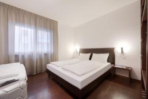 Postel nebo postele na pokoji v ubytování Hotel Asterix