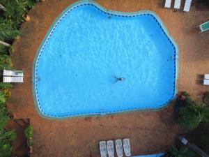 an overhead view of a large swimming pool at La Cautiva Iguazú Hotel in Puerto Iguazú