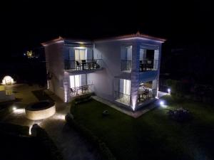 an aerial view of a house at night at Enpy in Finikounta