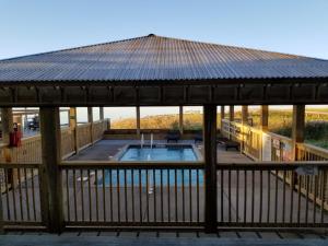 a gazebo with a swimming pool in it at The Inn on Pamlico Sound in Buxton
