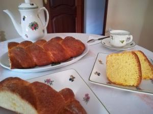 a table with two plates of bread and a cup of tea at Casa Bravo in Gondomar