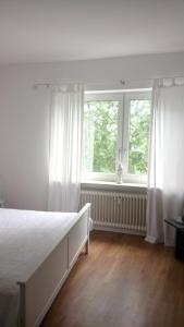 Postel nebo postele na pokoji v ubytování Cosyhome Apartment