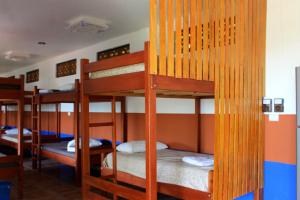 a group of bunk beds in a room at Hacienda bamb&uacute; in Bacalar