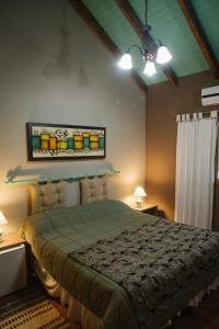 Una cama o camas en una habitación de Posada Vientos de Belgrano