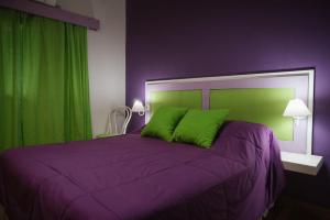 Una cama o camas en una habitación de Posada Vientos de Belgrano