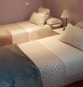 Un pat sau paturi într-o cameră la Pradera de San Isidro