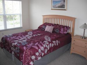 A bed or beds in a room at Venetian Bay Villa 4 Bedroom Townhouse - Near Disney