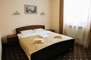 เตียงในห้องที่ Hotel Praha