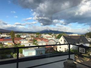 a view of a city from a balcony at Xalpen B&B in Puerto Natales