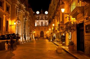 an empty street in a building at night at Hostelleria in Trapani