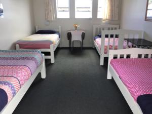 Postel nebo postele na pokoji v ubytování Tripinn Modern Motels & Affordable Accommodation
