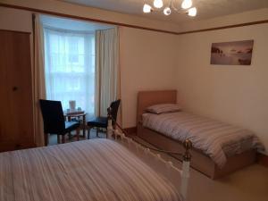 Postel nebo postele na pokoji v ubytování Bay Lodge