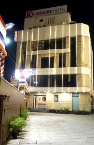 a building with a sign on top of it at KSquare Hotel in Chennai