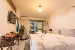 Ein Bett oder Betten in einem Zimmer der Unterkunft Pao Come Boutique House