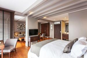 A television and/or entertainment centre at Marine Beach Hotel Pattaya - SHA Plus