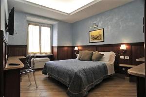 Postel nebo postele na pokoji v ubytování Residenza Matteucci