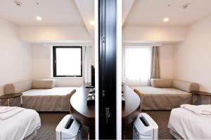 Postel nebo postele na pokoji v ubytování Sotetsu Fresa Inn Yokohama Sakuragi-cho