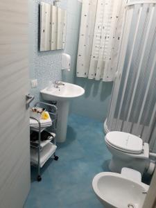 a bathroom with a toilet and a sink at A casa di Simona in Monreale