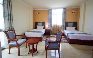 Hera Addis Hotel客房内的一张或多张床位
