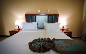 Hera Addis Hotel客房内的一张或多张床位