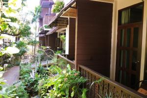 a porch of a house with plants on it at Mountain View GuesthouseChiangmai in Chiang Mai