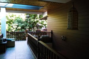 a porch of a house with a railing at Mountain View GuesthouseChiangmai in Chiang Mai