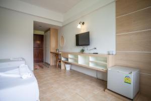 Postel nebo postele na pokoji v ubytování The Greenery Hotel
