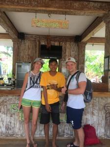 a group of three people standing in front of a building at Island Beach Bungalow in Gili Trawangan +38 photos