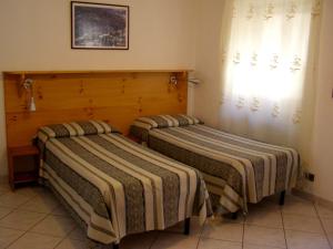 เตียงในห้องที่ L'Antico Borgo Rooms Rental