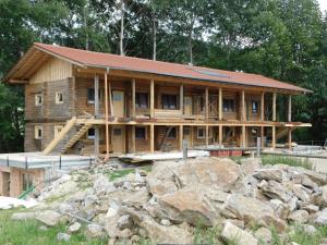 a house under construction with a large pile of rocks at Reiterhof Mühlbauer in Grattersdorf