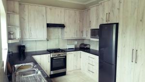 Kuchyň nebo kuchyňský kout v ubytování Knysna Paradise Guesthouse