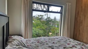 Postel nebo postele na pokoji v ubytování Knysna Paradise Guesthouse