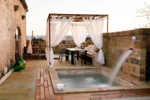 The swimming pool at or close to Dimora Sighé, exclusive rural villa with hydromassage pool