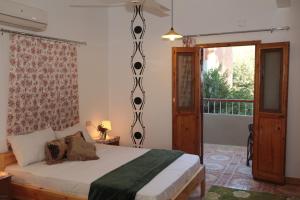 Postel nebo postele na pokoji v ubytování Amon Hotel