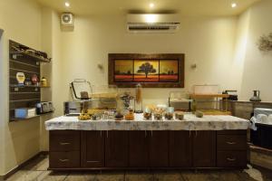 a kitchen with a counter with food on it at Villa Coralli in Parga