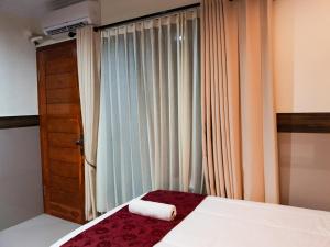Ein Bett oder Betten in einem Zimmer der Unterkunft Ogix Cliff Paradise