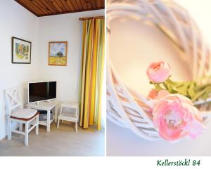 um quarto com uma cama com uma flor e uma televisão em Kellerstöckl 84 em Moschendorf