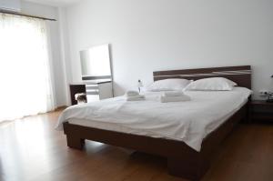 Llit o llits en una habitació de Alexys Residence 5