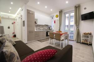 a living room and kitchen with a couch and a table at PaneAmore in Matera