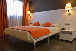 Postel nebo postele na pokoji v ubytování Hotel Can Batiste