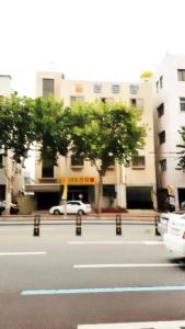 a street with a car parked in front of a building at Seong Dong Jang in Daegu