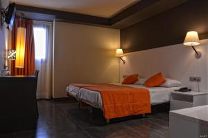 Postel nebo postele na pokoji v ubytování Hotel Can Batiste